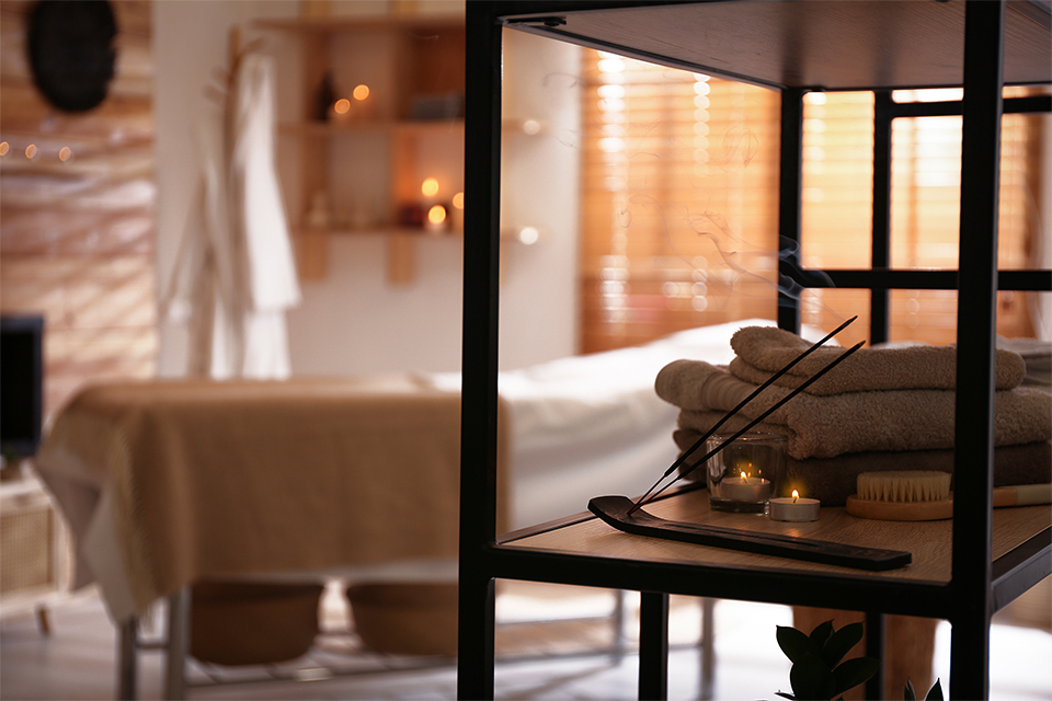 aromatic-incense-sticks-burning-candles-towels-spa-salon-interior-design